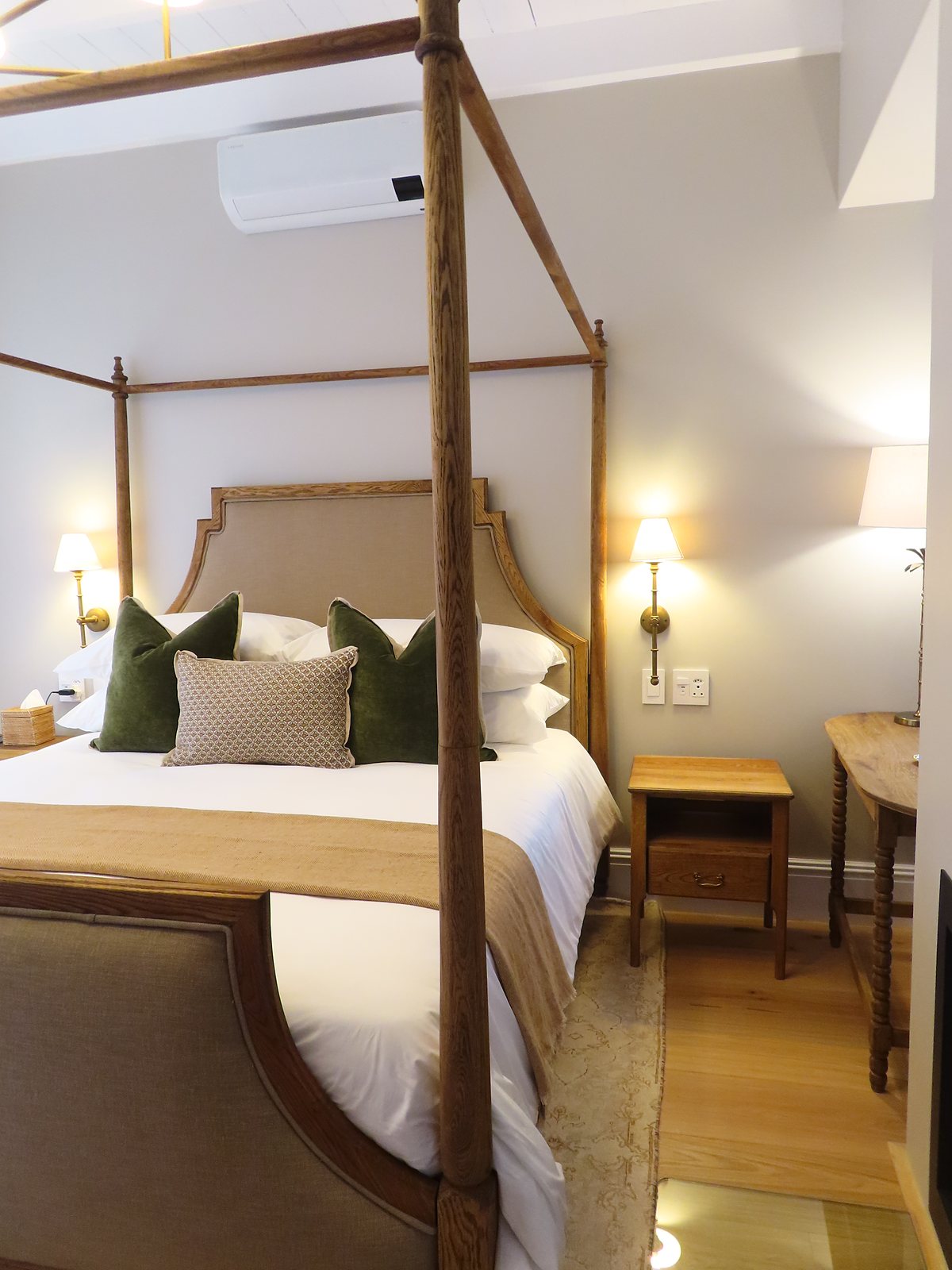 Four-poster bed in a suite at The Tulbagh Hotel