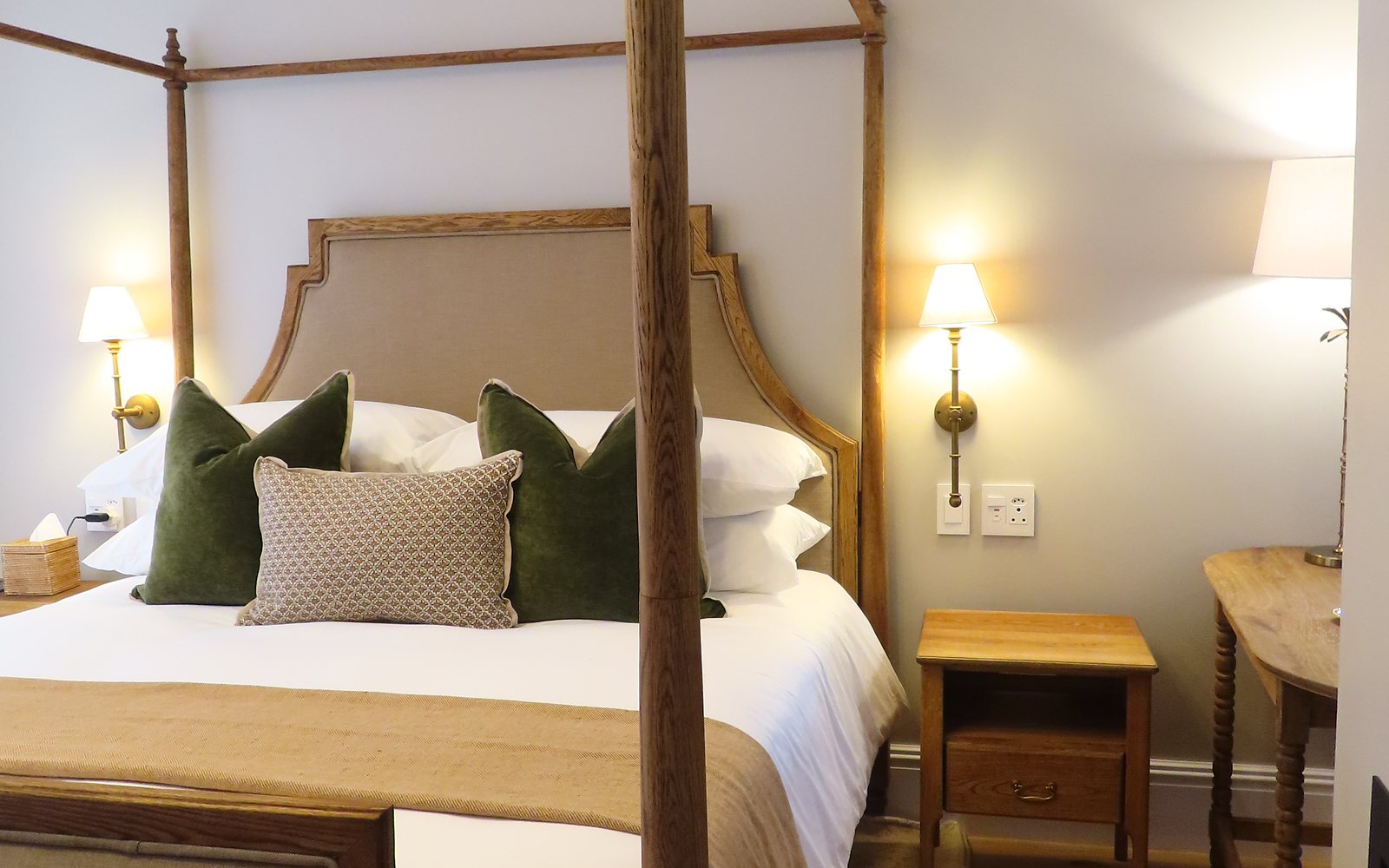 Four-poster bed in a suite at The Tulbagh Hotel